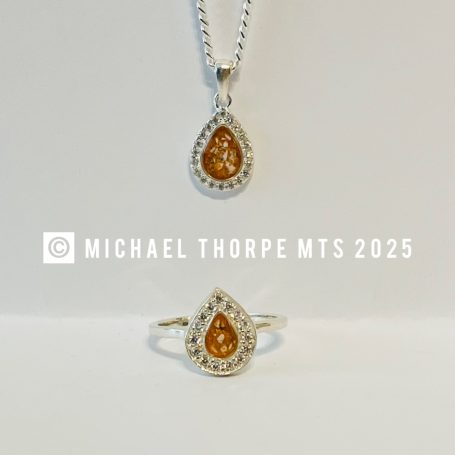 Small CZ stone set pendants and rings.